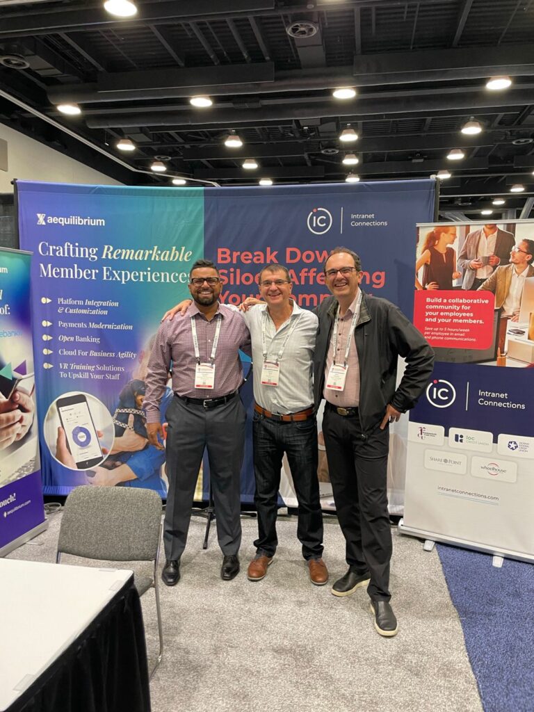 The AEQ team in front of our WCUC booth.