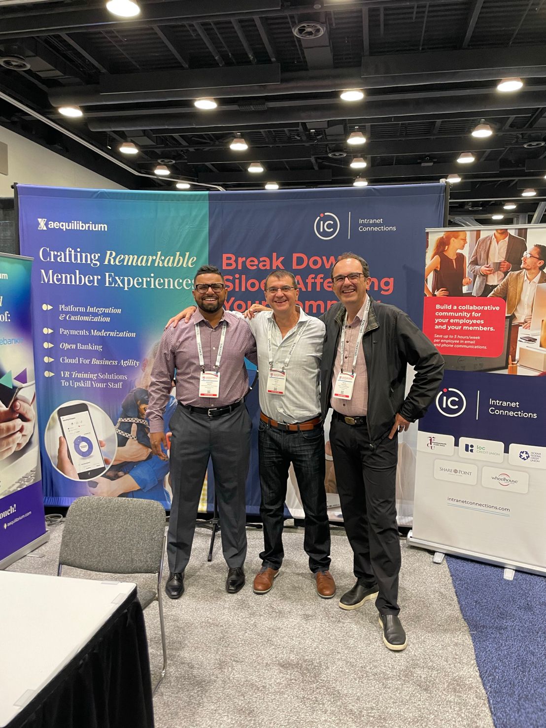 The AEQ team in front of our WCUC booth.